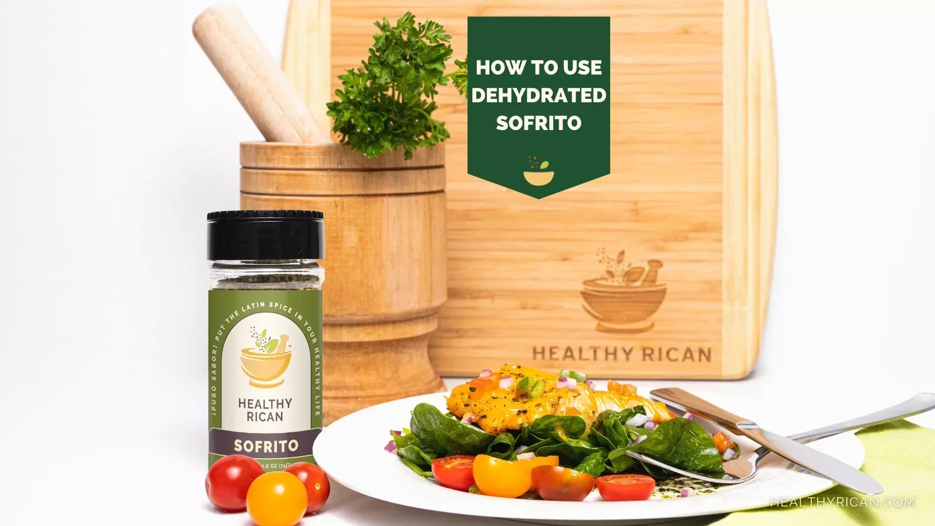 Dehydrated Sofrito seasoning beside a fresh spinach and tomato salad, showing how to use dehydrated Sofrito in flavorful Puerto Rican recipes.