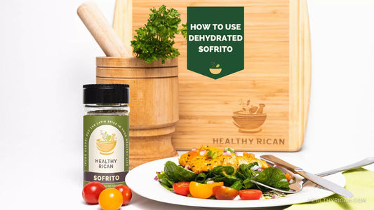 Dehydrated Sofrito seasoning beside a fresh spinach and tomato salad, showing how to use dehydrated Sofrito in flavorful Puerto Rican recipes.