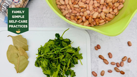 Simple self-care practices for families featuring wholesome ingredients such as beans, fresh cilantro, and bay leaves for healthy home cooking.