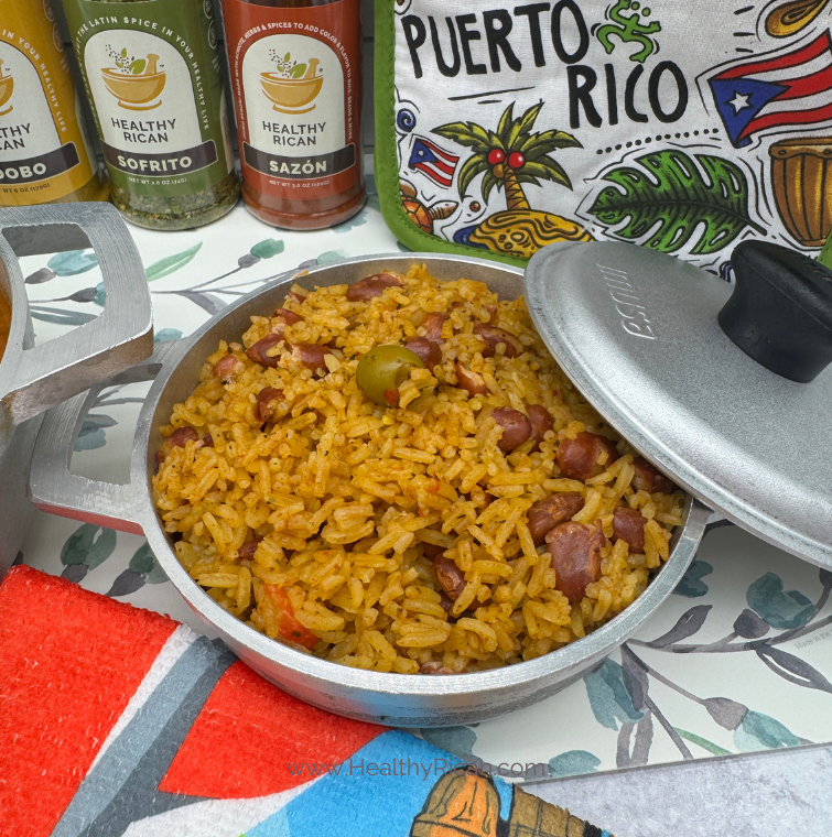 Health benefits of rice shown in Puerto Rican Arroz con Habichuelas made with seasoned rice, beans, olives, Sofrito, Adobo, and Sazón.