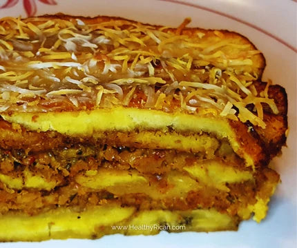 Puerto Rican Pastelón made with layers of sweet plantains, seasoned ground beef, and melted cheese baked until golden.