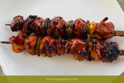 Puerto Rican Pinchos de Pollo grilled with peppers and onions, then coated in a smoky, savory barbecue-style secret sauce.
