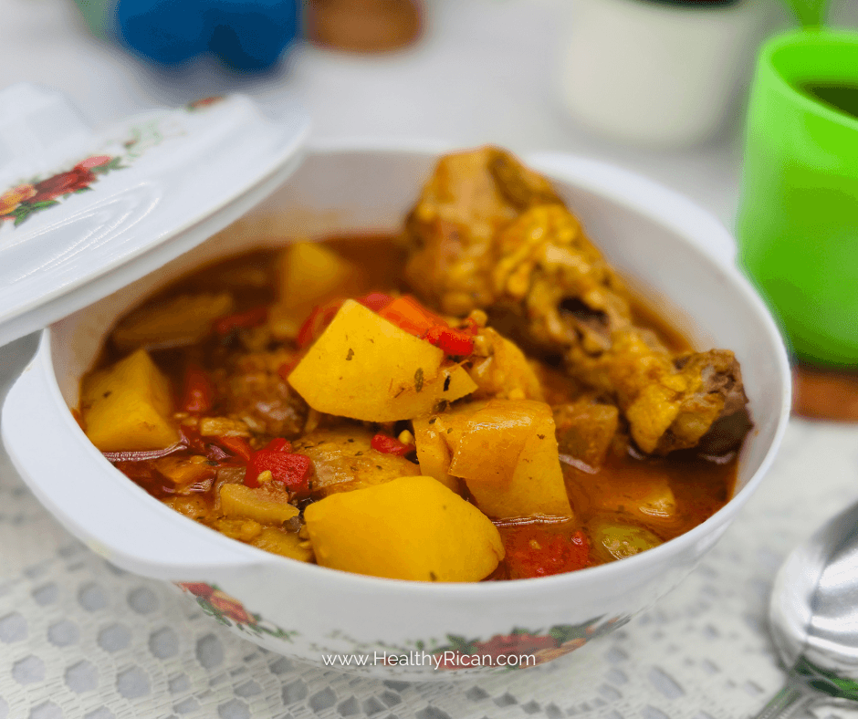 Savory pollo guisado with potatoes and peppers served in a bowl with rich Puerto Rican-style stew