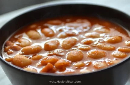 Ways to use Sofrito shown in a bowl of Puerto Rican Habichuelas Guisadas with tender beans in a rich tomato-based sauce.