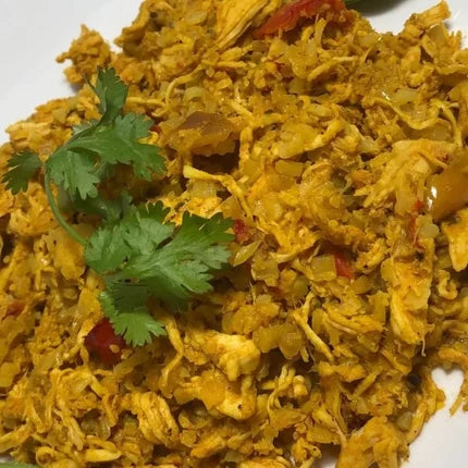 Whole30 Approved seasonings used in cauliflower Arroz con Pollo with shredded chicken, peppers, onions, and fresh cilantro.